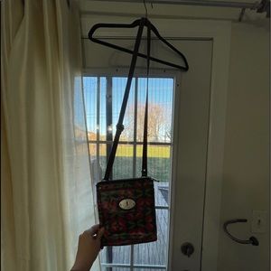 Small Fossil Crossbody with a flower print on it.